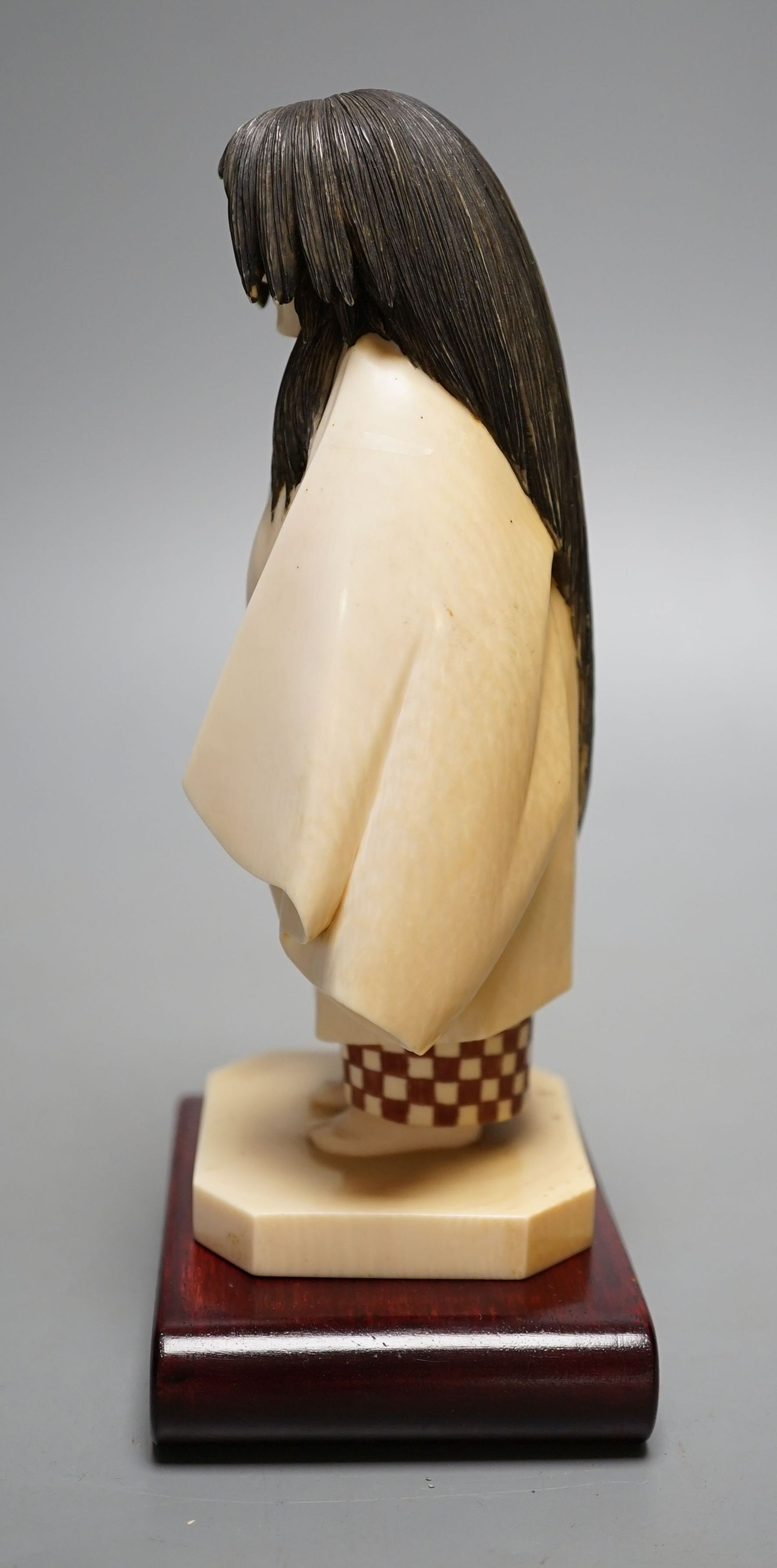 A Japanese ivory figure of a priest, Taisho/early Showa period, signed to a lacquer tablet - 17cm tall